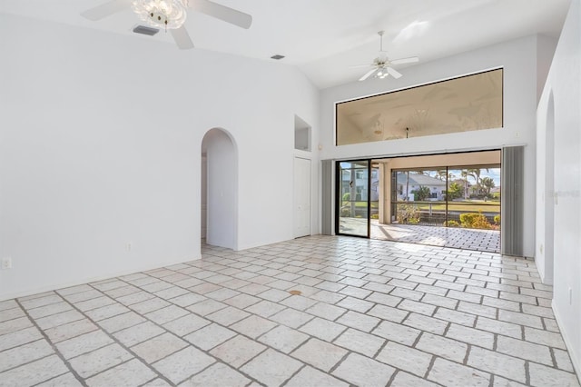 unfurnished room featuring ceiling fan and high vaulted ceiling