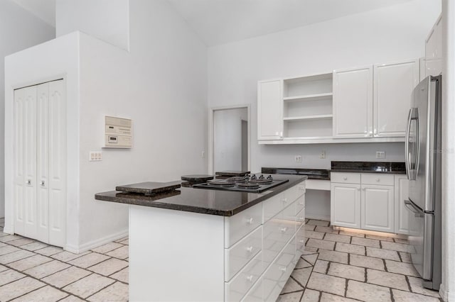 kitchen featuring stainless steel appliances and white cabinetry