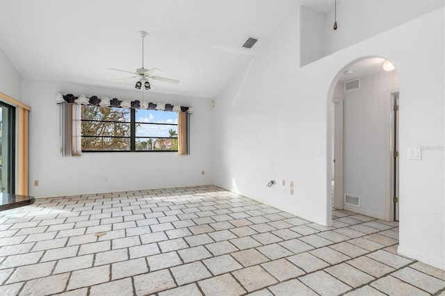 spare room with high vaulted ceiling and ceiling fan