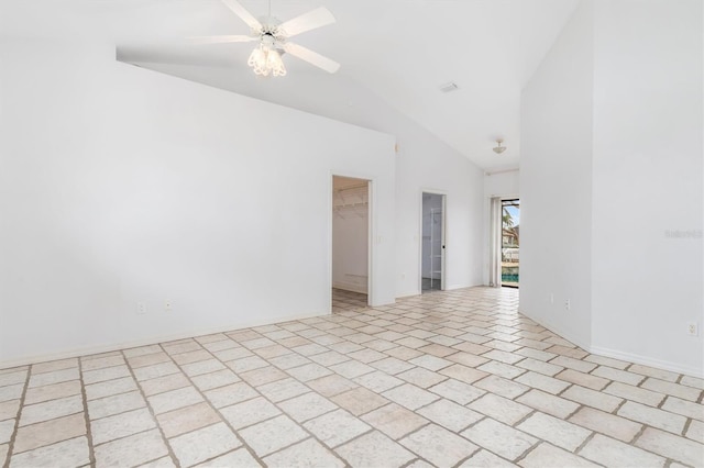 spare room with high vaulted ceiling and ceiling fan