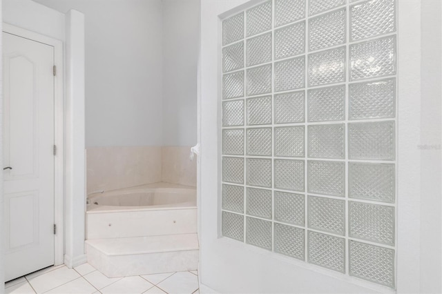 bathroom featuring a tub to relax in and tile patterned floors