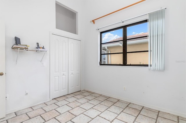 unfurnished bedroom featuring a closet