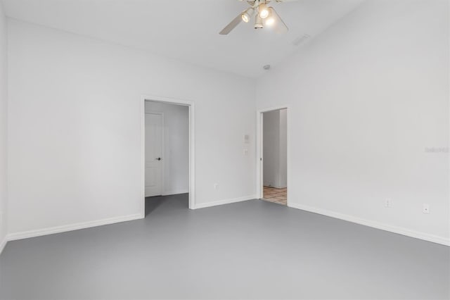 unfurnished bedroom featuring ceiling fan, lofted ceiling, and concrete flooring