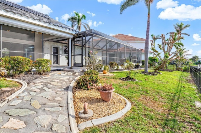 view of yard featuring glass enclosure