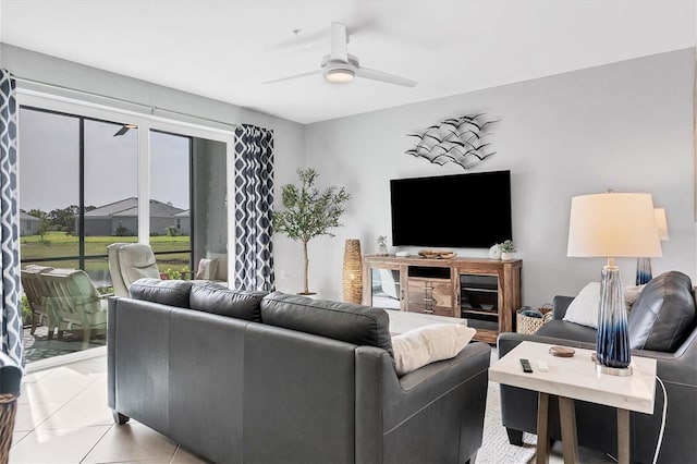 living room with ceiling fan and light tile patterned floors