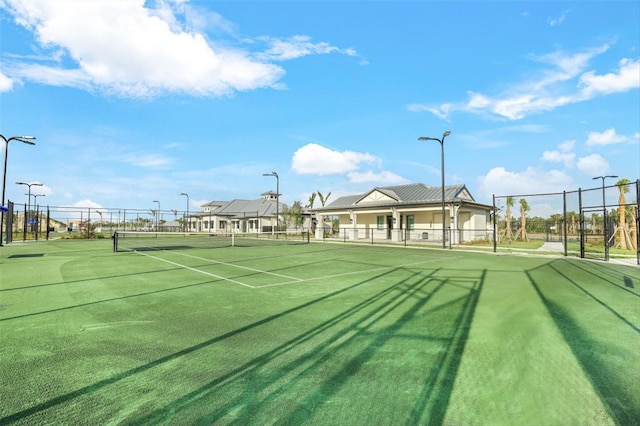 view of sport court with fence