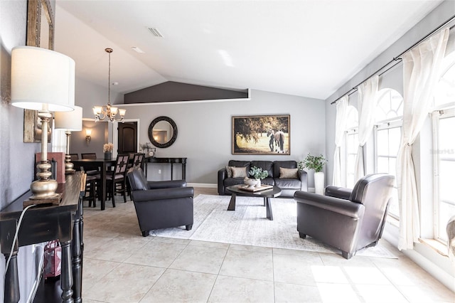 tiled living room featuring lofted ceiling and an inviting chandelier