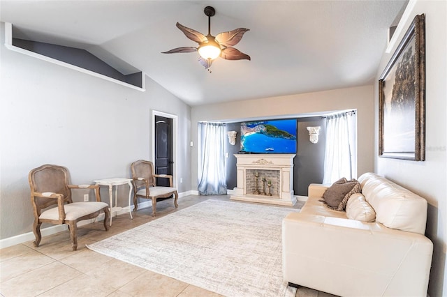 tiled living room featuring vaulted ceiling and ceiling fan