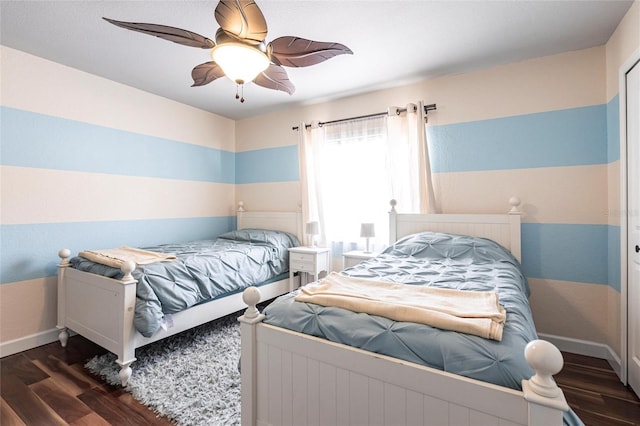 bedroom featuring dark hardwood / wood-style floors and ceiling fan