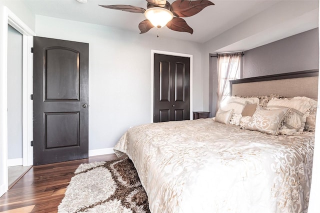 bedroom featuring dark wood-type flooring and ceiling fan