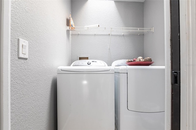 washroom with separate washer and dryer