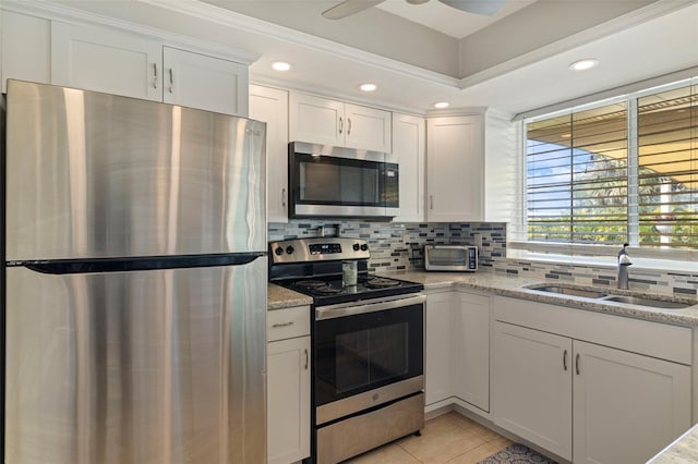 kitchen with white cabinetry, appliances with stainless steel finishes, and a sink