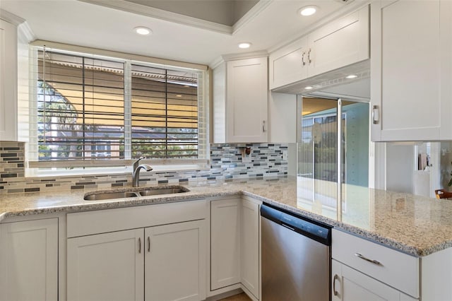 kitchen featuring backsplash, white cabinets, a sink, light stone countertops, and dishwasher