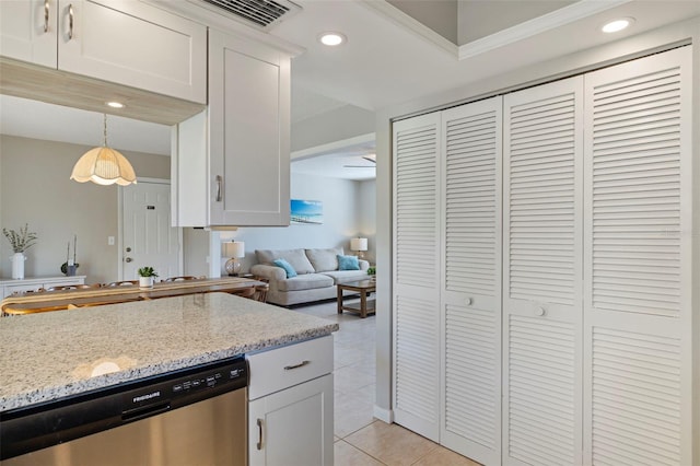 kitchen with dishwasher, hanging light fixtures, and white cabinetry