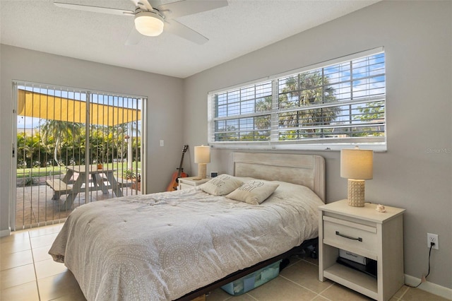 bedroom featuring access to exterior, a ceiling fan, a textured ceiling, and light tile patterned flooring