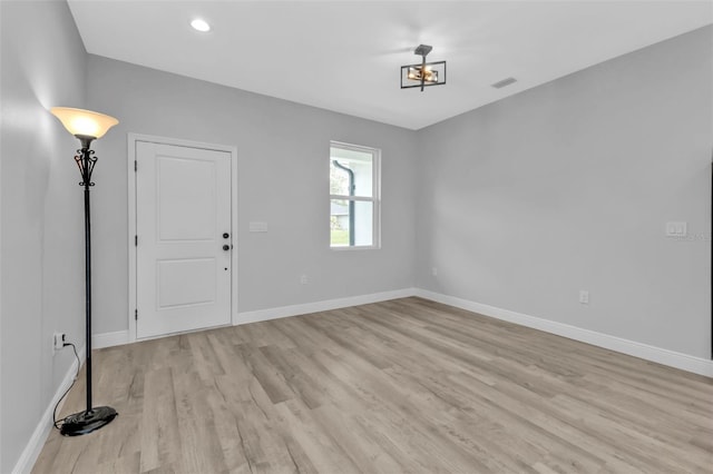 unfurnished room featuring light hardwood / wood-style floors