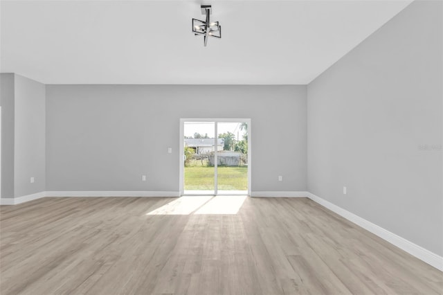 unfurnished living room with light wood-type flooring