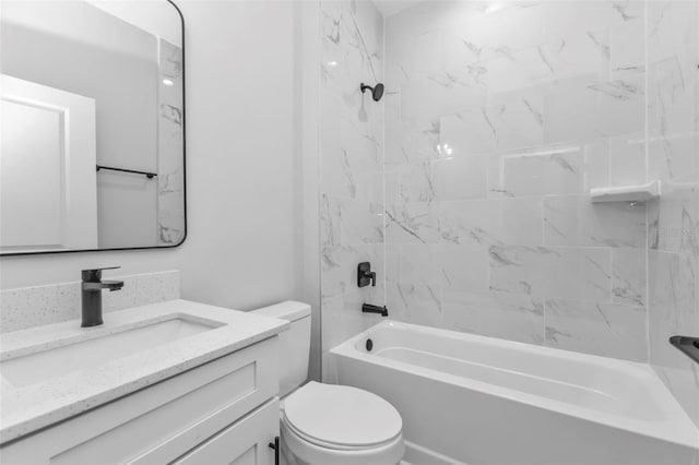 full bathroom with vanity, tiled shower / bath combo, and toilet