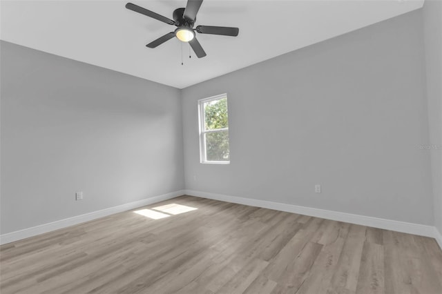 empty room with light hardwood / wood-style flooring and ceiling fan