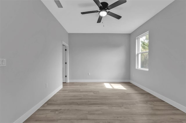 spare room with ceiling fan and light hardwood / wood-style flooring