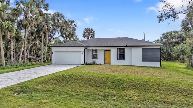 ranch-style house with a garage and a front yard