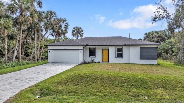 single story home with a garage and a front yard