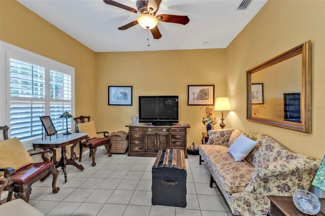 living area featuring visible vents, ceiling fan, and light tile patterned flooring