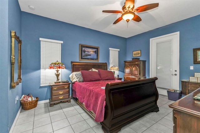 bedroom with light tile patterned floors, baseboards, and a ceiling fan