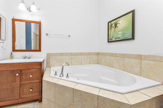 full bathroom with tile patterned floors, a bath, and vanity