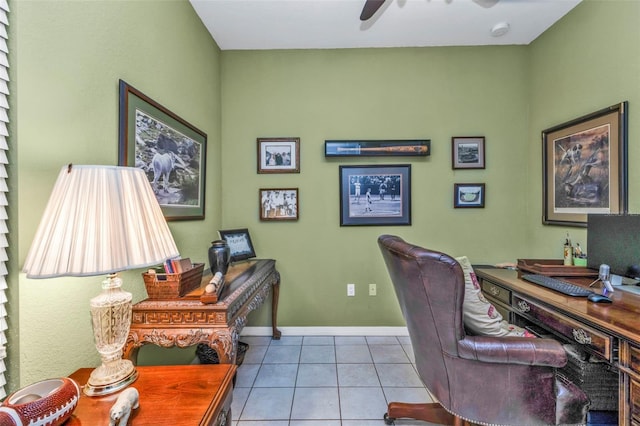 tiled office featuring baseboards and ceiling fan