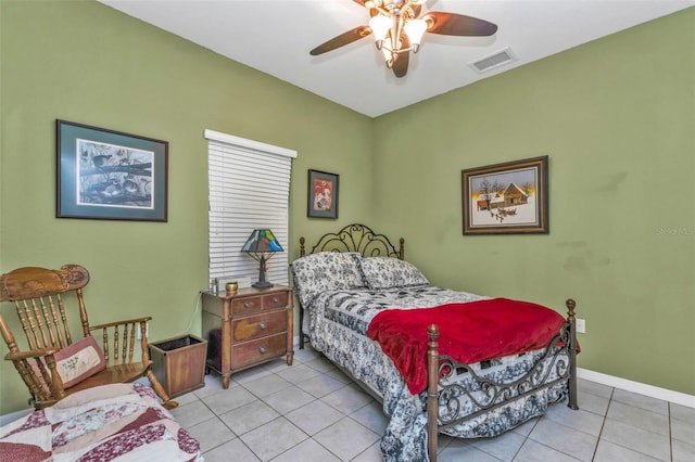 bedroom with baseboards, ceiling fan, light tile patterned flooring, and visible vents