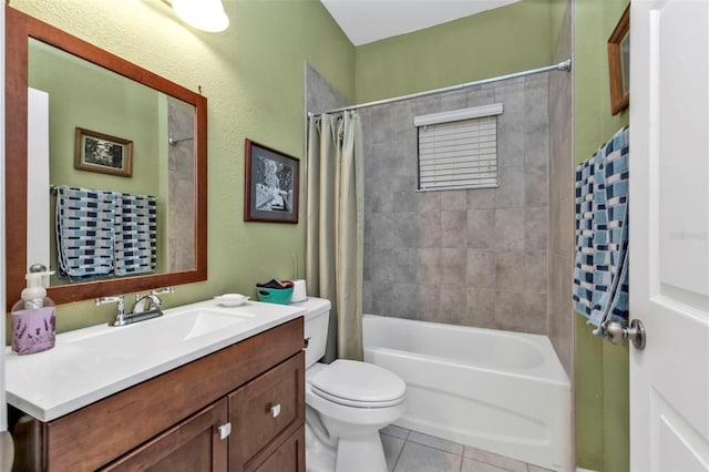 bathroom with tile patterned floors, vanity, toilet, and shower / tub combo
