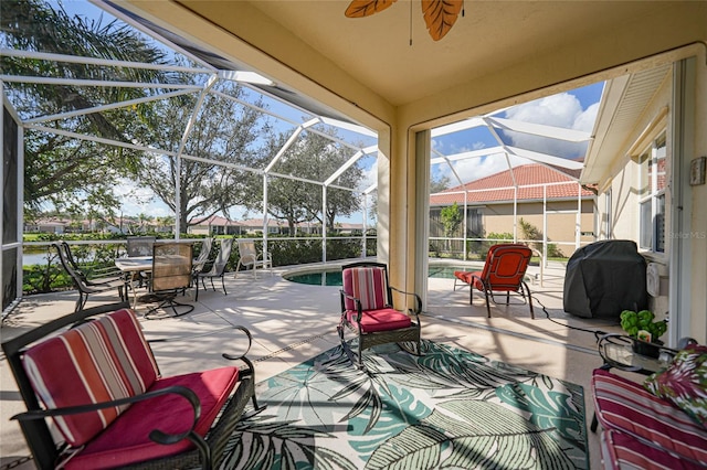 view of patio / terrace featuring ceiling fan, a grill, and glass enclosure