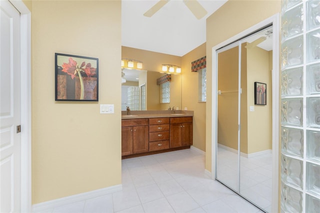 bathroom featuring vanity, tile patterned flooring, and ceiling fan