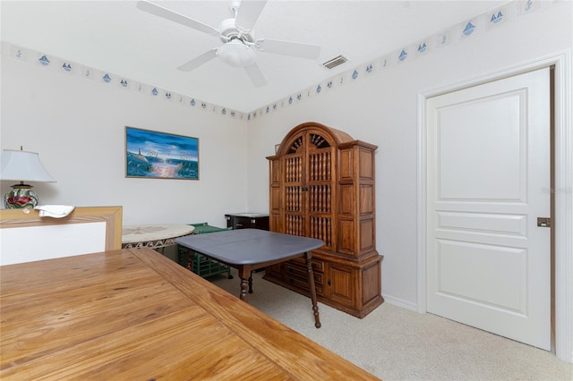 dining room featuring ceiling fan and carpet flooring