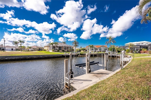 view of dock featuring a yard and a water view