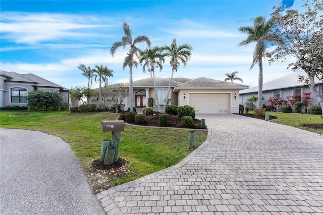 ranch-style house with a garage and a front lawn