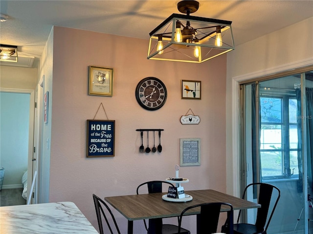 dining room featuring a chandelier