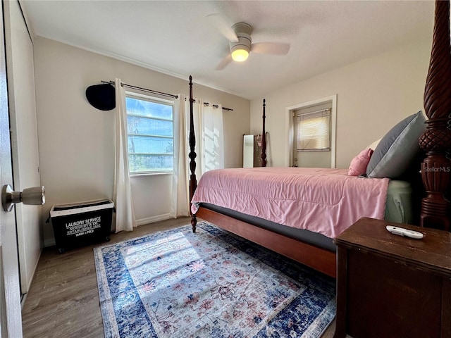 bedroom featuring ceiling fan and light hardwood / wood-style flooring