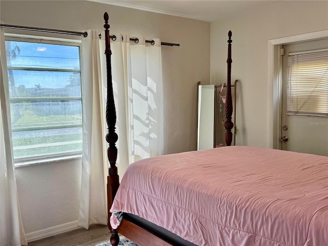 bedroom with hardwood / wood-style floors