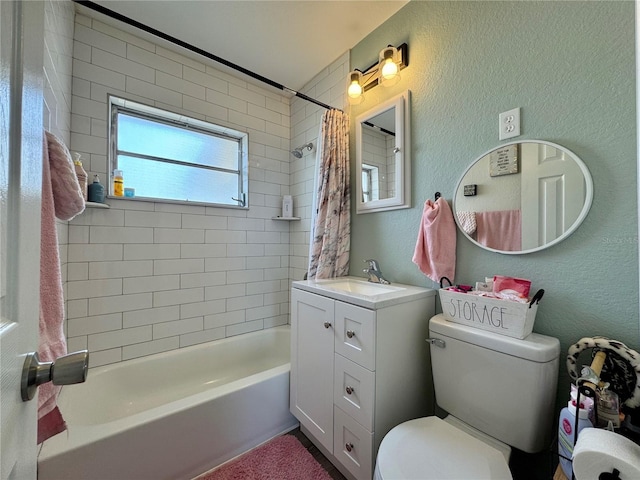 full bathroom featuring vanity, shower / bath combination with curtain, and toilet