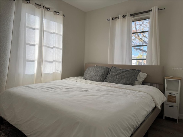 bedroom featuring dark hardwood / wood-style flooring