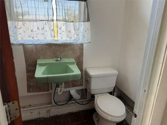 bathroom with toilet and sink