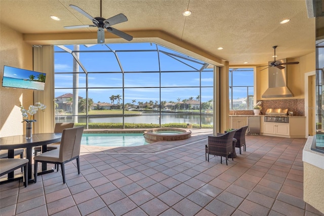 view of patio featuring a water view, area for grilling, and a lanai