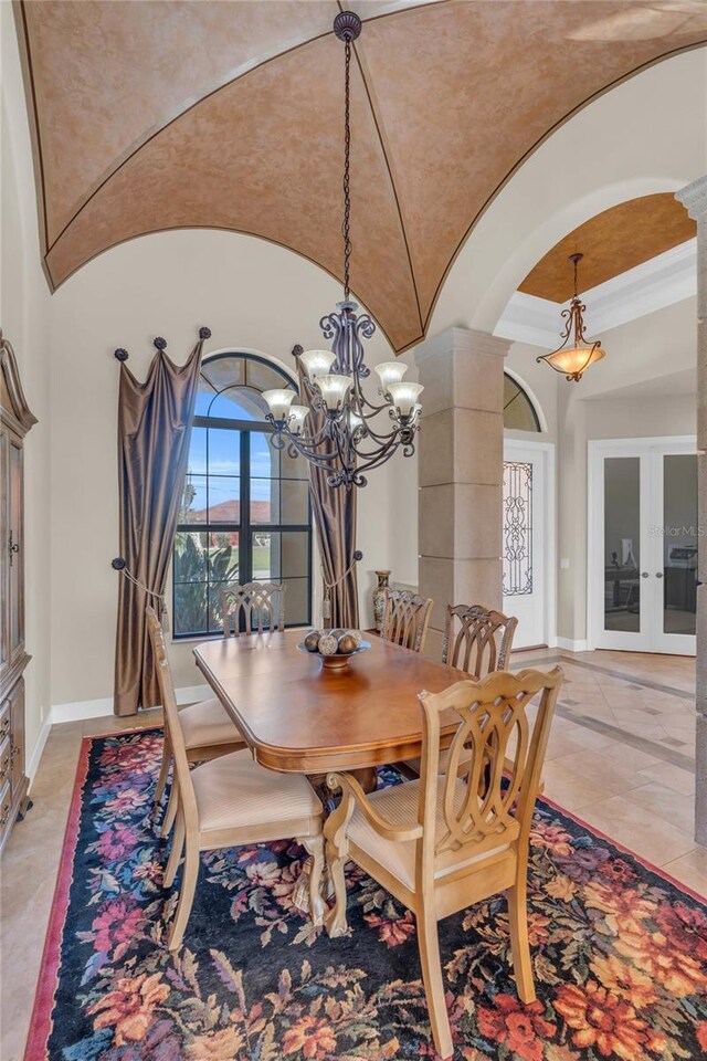3321 Tripoli Blvd, Punta Gorda, FL 33950 - dining room with ornate columns, crown molding, and lofted ceiling