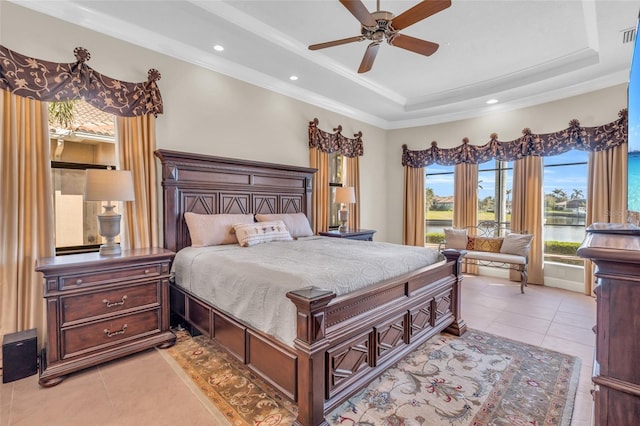 3321 Tripoli Blvd, Punta Gorda, FL 33950 - bedroom with ornamental molding, a water view, light tile patterned floors, and a tray ceiling