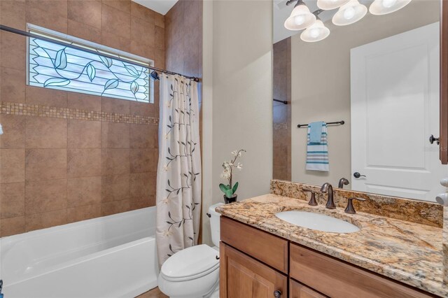 3321 Tripoli Blvd, Punta Gorda, FL 33950 - full bathroom featuring shower / tub combo with curtain, vanity, and toilet