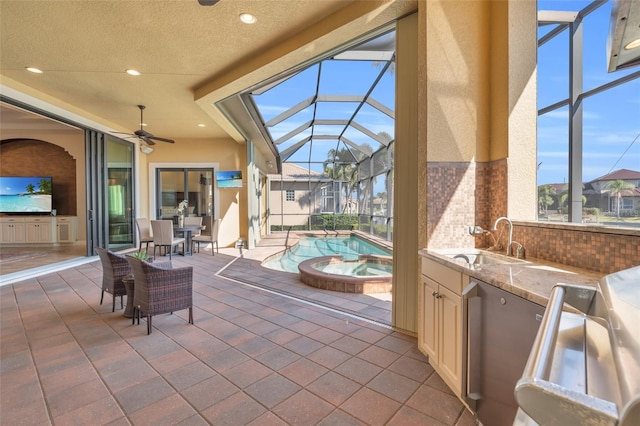 3321 Tripoli Blvd, Punta Gorda, FL 33950 - view of patio with area for grilling, an in ground hot tub, a lanai, an outdoor wet bar, and ceiling fan