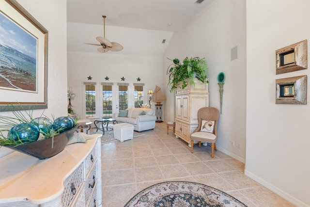 interior space featuring ceiling fan, light tile patterned floors, high vaulted ceiling, and french doors