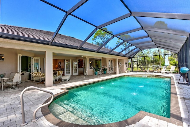 view of pool with a lanai and a patio area